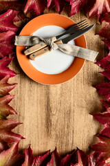 Rustic Thanksgiving Table Setting with Leaves and Plate