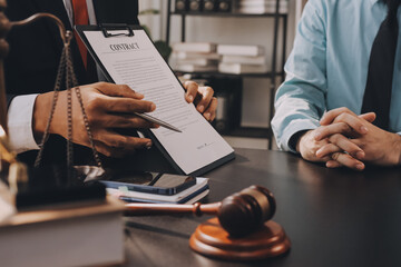 Lawyer explained to the client about the law that must be brought against the court case.