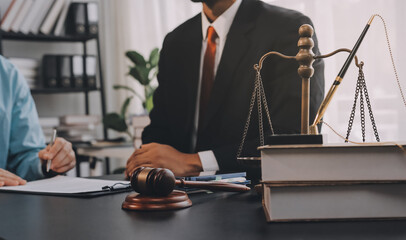 Lawyer explained to the client about the law that must be brought against the court case.