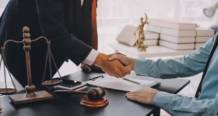 Lawyer explained to the client about the law that must be brought against the court case.