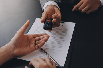 Car salesman gave the keys to the customers who signed the purchase contract legally, Successful...