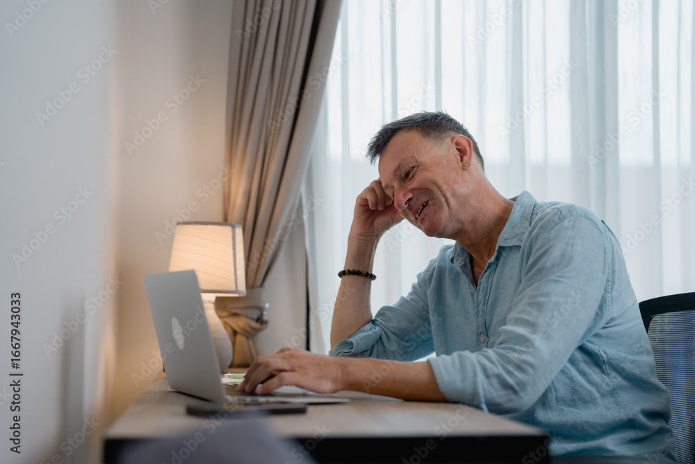 Aufkleber happy businessman working from home, smiling while enjoying tasks on his laptop, browsing the intern