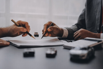 Car salesman gave the keys to the customers who signed the purchase contract legally, Successful...