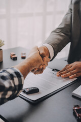 Car salesman gave the keys to the customers who signed the purchase contract legally, Successful...