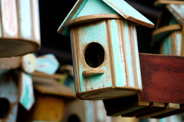 Rustic Wooden Birdhouse with Mint Green and Brown Color Scheme