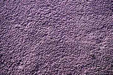 Textured Purple Wall Surface with Unique Patterns and Details