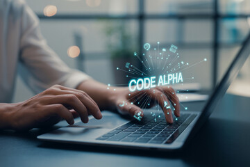 Person working on a laptop with a code alpha digital overlay and network connections.