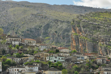 Hillside Village Beneath Steep Cliffs