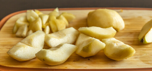 autumn pear slices on wooden cutting board healthy fruit