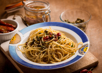 spaghetti with anchovies dried tomatoes and capers