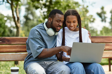 Young couple enjoys a romantic stroll while sharing laughter and love on a sunny day