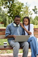 Charming couple enjoying a joyful stroll through a vibrant park filled with warmth and love