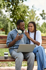 Joyful couple enjoying each others company during a sunny outdoor stroll