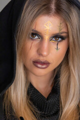 creepy halloween portrait woman with witch face makeup