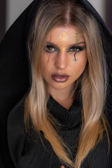 creepy halloween portrait woman with witch face makeup