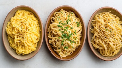 Three bowls of spaghetti in different shapes, placed at different angles to show off their shape, are perfect for online food social media posts or advertising banners.