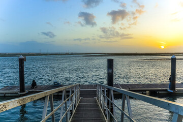 View of sunset near ocean in Faro, Portugal