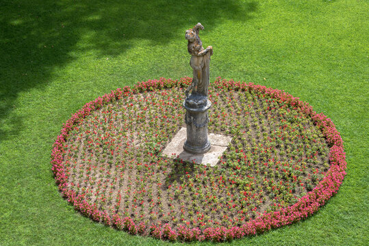 Flowerbed and statue, Barben, France