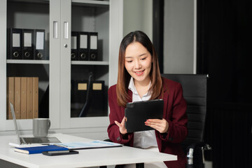 Businesswoman analyzing financial graphs, calculating company expenses, and planning investments.