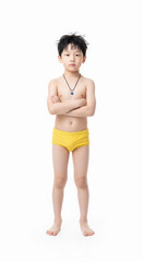 Obraz premium A confident young boy stands with his arms crossed. A studio portrait symbolizing childhood health, body positivity, strength, and self-esteem.