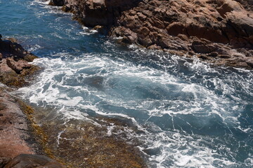 waves crashing on rocks