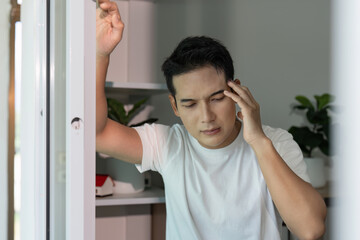 Mental Health Awareness. Young man experiencing stress and anxiety at home.