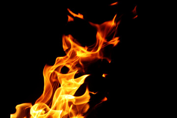 Close up burning flames on black background for graphic design or wallpaper.