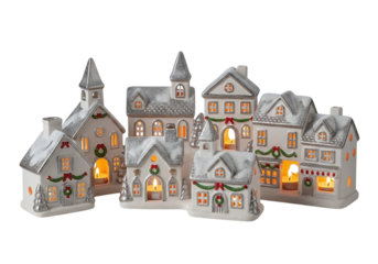 Collection of illuminated ceramic village houses isolated on transparent background