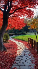 Red maple tree leaves cover a stone path leading through a beautiful park