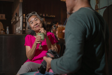 Senior couple enjoying coffee in a cozy cafe,