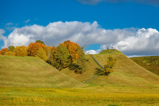 Historic Kernave mounds in Lithuania surrounded by autumn forest