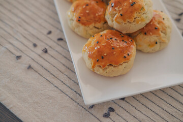 turkish savory pastry pogaca with dill and black sesame or cumin, homemade quick snack