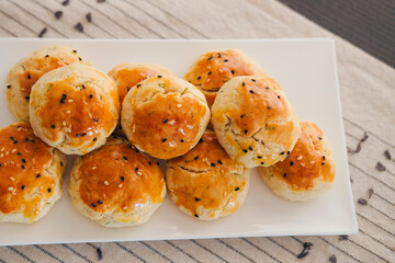 turkish savory pastry pogaca with dill and black sesame or cumin, homemade quick snack served on...