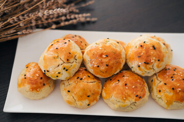 turkish savory pastry pogaca with dill and black sesame or cumin, homemade quick snack