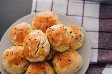 turkish savory pastry pogaca with dill and black sesame or cumin, homemade quick snack