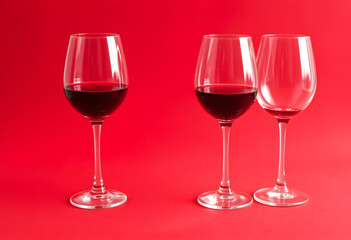 Three Wine Glasses on a Red Surface