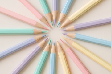 Fototapeta premium Colorful arranged pencils in a circular pattern on a plain background