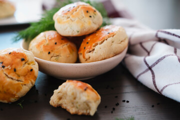 turkish savory pastry pogaca with dill and black sesame or cumin, homemade quick snack
