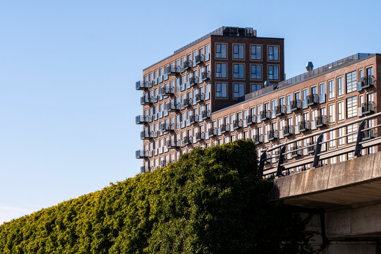 Elevated residential buildings in Orestad, Copenhagen, Denmark, illustrating creative architectural design, urban layers and contemporary European housing in planned city development