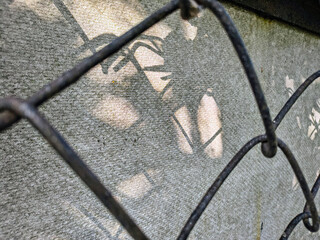 wire fence. chain link mesh. rusty iron fence. old rusty cage. symbol of freedom. symbols of...