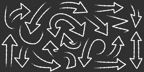Hand Drawn White Chalk Arrows on Dark Background Pointing in Different Directions