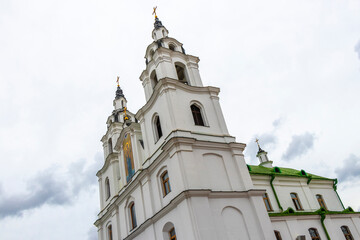 Holy Spirit Cathedral church and dark storm clouds in Minsk Belarus.