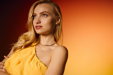 Young stylish woman exuding confidence in vibrant yellow attire against a warm backdrop