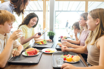Students enjoying lunch together in a bright and inviting school cafeteria