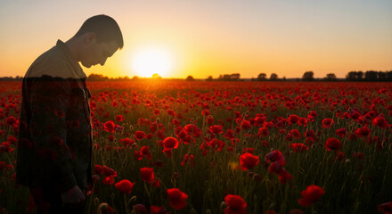 Soldier silhouette in a poppy field at sunset. Man honoring fallen soldiers in a field of red flowers. Remembrance Day, Poppy Day, Veterans Day, Memorial Day