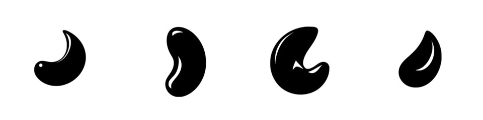 Collection of black glossy bean shapes varying in size and curvature on a white background