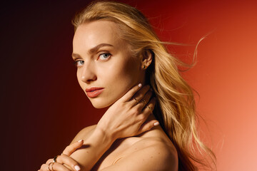 Stylish young woman radiating elegance in casual attire against a vibrant backdrop