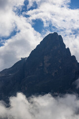 Obraz premium The mountains shrouded in clouds seen from San Martino di Castrozza - Italy