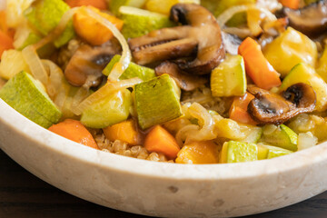 vegetarian quinoa bowl with zucchini carrots mushrooms roasted fall food