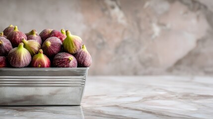 Fresh figs in metallic tray on marble surface ,National Fig Week